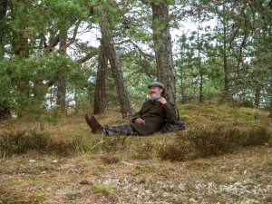 joakim resting against tree